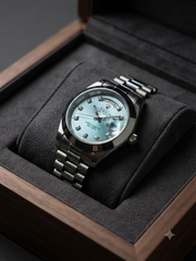 Rolex silver with light blue dial day -date