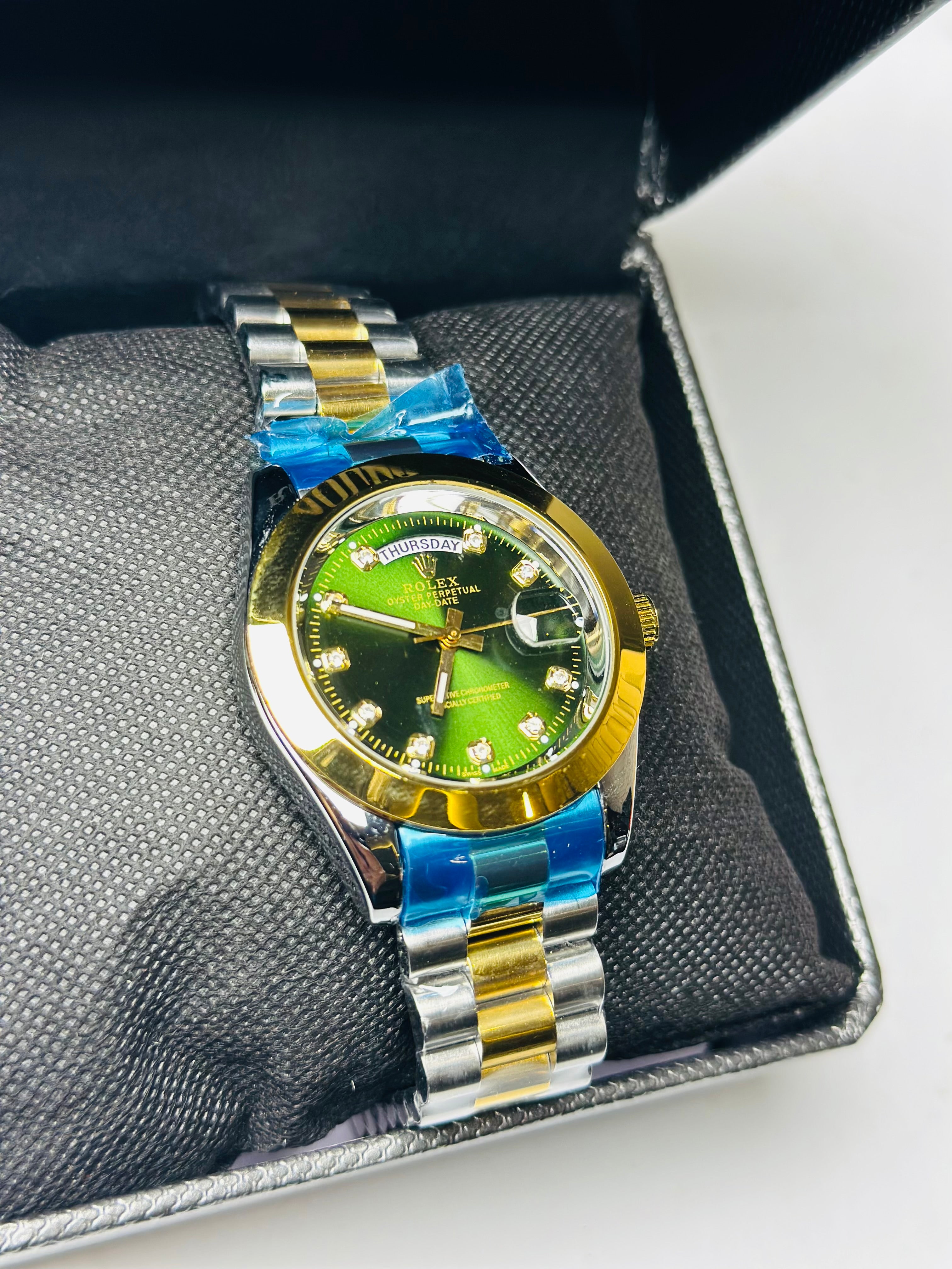 R*lex silver golden green dial day date