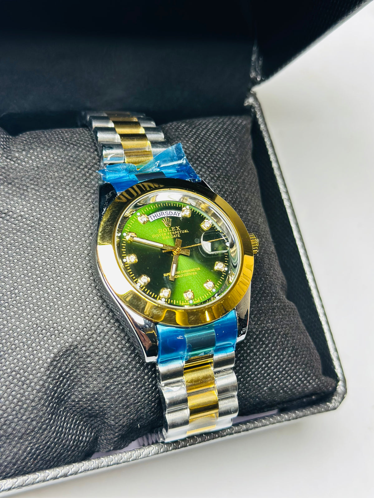 R*lex silver golden green dial day date